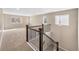 A staircase features carpeted steps and a dark railing, leading up to the upper level of the home at 3522 Harvard Pl, Broomfield, CO 80023