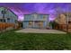 Spacious backyard featuring a large patio and lush green lawn, perfect for outdoor entertaining at 1544 E Weldona Way, Superior, CO 80027