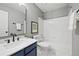 Modern bathroom featuring a sleek vanity, contemporary fixtures, and a clean, tiled shower-tub combination at 1544 E Weldona Way, Superior, CO 80027