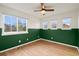 Bright bedroom with hardwood floors, neutral walls, and ample natural light streaming through multiple windows at 1544 E Weldona Way, Superior, CO 80027