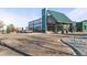 Exterior view of the Superior Community Center with a metal roof, glass walls and a wide covered entry way at 1544 E Weldona Way, Superior, CO 80027