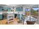Bright kitchen and eating nook boasts stainless appliances, island, and adjacent deck access at 1544 E Weldona Way, Superior, CO 80027