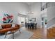 Bright living room with tall ceilings, modern chandelier, wood floors, and ample natural light at 1544 E Weldona Way, Superior, CO 80027