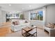Cozy living room with open concept to a large backyard window and an updated kitchen at 1544 E Weldona Way, Superior, CO 80027