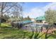 Community pool area featuring multiple pools, shaded lounging spaces, and well-maintained landscaping for recreation at 1544 E Weldona Way, Superior, CO 80027