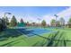 Well-maintained community tennis courts surrounded by lush greenery, offering a perfect spot for recreation at 1544 E Weldona Way, Superior, CO 80027