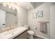 Modern bathroom with stylish vanity, gold fixtures, and a sleek mirror at 2279 E 129Th Ave, Thornton, CO 80241