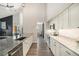 Modern kitchen with granite countertops, white cabinets, stainless steel appliances, and hardwood floors at 2279 E 129Th Ave, Thornton, CO 80241
