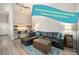 Inviting living room features a comfortable leather sectional sofa and stylish decor, perfect for relaxation at 2279 E 129Th Ave, Thornton, CO 80241