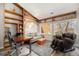 Comfortable office with vaulted ceilings, built-in shelves, and a comfortable couch for relaxation and remote work at 2279 E 129Th Ave, Thornton, CO 80241