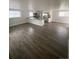 Open floor plan with spacious kitchen, large island, and stainless steel appliances at 8220 E 104Th Way, Henderson, CO 80640