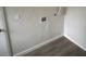 Utility room showcasing laundry hookups and space for appliances, enhancing convenience at 8220 E 104Th Way, Henderson, CO 80640