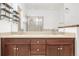 Bathroom features tiled floors, double sink vanity, and glass enclosed shower at 11972 W Long Cir # 204, Littleton, CO 80127