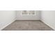 A bright bedroom with large window and neutral carpet at 11972 W Long Cir # 204, Littleton, CO 80127