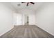 This bedroom features vaulted ceiling, neutral carpet, and two entry doors at 11972 W Long Cir # 204, Littleton, CO 80127