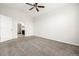 This bedroom features vaulted ceiling, neutral carpet, and an entry door at 11972 W Long Cir # 204, Littleton, CO 80127