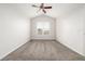 Bright bedroom features vaulted ceiling, neutral carpet, and a window with blinds at 11972 W Long Cir # 204, Littleton, CO 80127