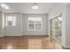 Dining space with hardwood flooring features large windows, bright light and access to backyard at 11972 W Long Cir # 204, Littleton, CO 80127