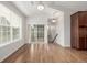 Open dining room with hardwood floors, and access to backyard area through glass sliding doors at 11972 W Long Cir # 204, Littleton, CO 80127