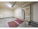 Garage with hanging hook, and side door at 11972 W Long Cir # 204, Littleton, CO 80127