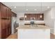 Eat-in kitchen features stainless steel appliances and granite countertops at 11972 W Long Cir # 204, Littleton, CO 80127