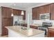 Kitchen includes stainless appliances and eat in island at 11972 W Long Cir # 204, Littleton, CO 80127