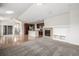 Open floor plan with kitchen and living room, fireplace, and hardwood floors at 11972 W Long Cir # 204, Littleton, CO 80127