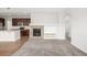 Open floor plan with living room, fireplace, plush carpet and connected to kitchen at 11972 W Long Cir # 204, Littleton, CO 80127