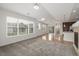 Open floor plan with living room, kitchen and dining area, carpet, and hardwood floors at 11972 W Long Cir # 204, Littleton, CO 80127