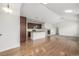 Open floor plan with kitchen, living room and dining area with hardwood and carpet at 11972 W Long Cir # 204, Littleton, CO 80127