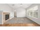 Bright living room with carpet, fireplace, and vaulted ceilings leads to the other rooms at 11972 W Long Cir # 204, Littleton, CO 80127