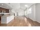 Open concept living area with hardwood floors and a fireplace at 11972 W Long Cir # 204, Littleton, CO 80127