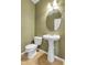 Bathroom with a pedestal sink and toilet at 12793 Leyden St # D, Thornton, CO 80602