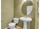Small bathroom with pedestal sink and toilet at 12793 Leyden St # D, Thornton, CO 80602