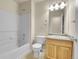Cozy bathroom with shower-tub combination, single sink vanity and modern fixtures at 12793 Leyden St # D, Thornton, CO 80602