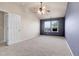 Bright, airy bedroom with vaulted ceilings, ceiling fan, and well-lit with two windows at 12793 Leyden St # D, Thornton, CO 80602