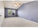 Inviting bedroom featuring a vaulted ceiling, ceiling fan, and ample natural light at 12793 Leyden St # D, Thornton, CO 80602