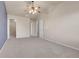 Spacious bedroom with ample closet space, ceiling fan, vaulted ceilings, and natural light at 12793 Leyden St # D, Thornton, CO 80602