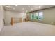 Spacious bonus room with plush carpeting and large windows providing plenty of natural light at 12793 Leyden St # D, Thornton, CO 80602