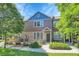 Charming home featuring a mix of stone and siding, well-manicured lawn, and inviting front entrance at 12793 Leyden St # D, Thornton, CO 80602
