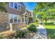Charming townhouse with stone detailing, landscaped front yard, and inviting entrance on a sunny day at 12793 Leyden St # D, Thornton, CO 80602