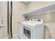 Functional laundry room with modern appliances and ample shelving for storage at 12793 Leyden St # D, Thornton, CO 80602