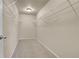 Well-organized walk-in closet featuring ample shelving and storage space for clothing at 12793 Leyden St # D, Thornton, CO 80602