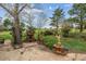 Spacious backyard with a brick outdoor fireplace and charming water fountain feature at 541 Yucca Hills Rd, Castle Rock, CO 80109