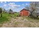 Rustic barn with weathered red paint, providing storage and character to the property at 541 Yucca Hills Rd, Castle Rock, CO 80109