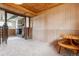 Basement space featuring a stone fireplace, wood-beam ceiling, and adjacent side table at 541 Yucca Hills Rd, Castle Rock, CO 80109