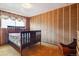 Bedroom featuring patterned wall panels and window with patterned curtains at 541 Yucca Hills Rd, Castle Rock, CO 80109