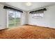 Spacious bedroom featuring a sliding glass door with exterior views at 541 Yucca Hills Rd, Castle Rock, CO 80109