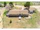 Picturesque property with ranch-style home, detached garage, and lush green surroundings at 4295 S County Road 193, Byers, CO 80103
