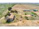 Aerial view of the property featuring barns and housing at 4295 S County Road 193, Byers, CO 80103